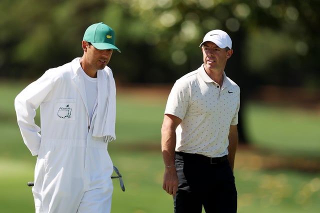 AUGUSTA, GEORGIA - APRIL 08: (R-L) Rory McIlroy of Northern Ireland and caddie Harry Diamond look on from the practice range during a practice round prior to the 2025 Masters Tournament at Augusta National Golf Club on April 08, 2025 in Augusta, Georgia.
