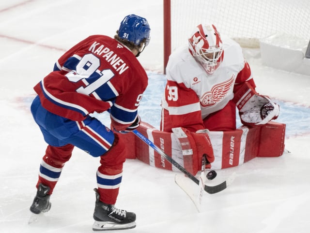 Detroit Red Wings  goaltender Cam Talbot (39) stops a shot by Montreal Canadiens' Oliver Kapanen (91) during second period NHL hockey action in Montreal on Tuesday, April 8, 2025. THE CANADIAN PRESS/Christinne Muschi
