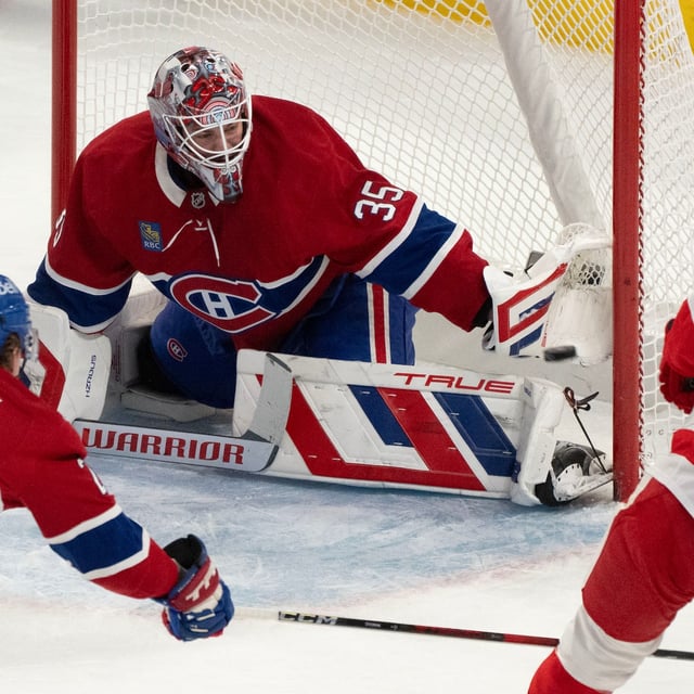 Montreal Canadiens goaltender Sam Montembeault (35) stops a shot by Detroit Red Wings' Alex DeBrincat (93) during first period NHL hockey action in Montreal on Tuesday, April 8, 2025. THE CANADIAN PRESS/Christinne Muschi