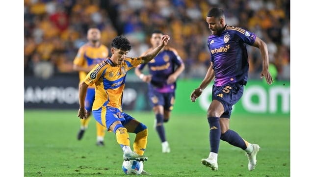 Tigres’ Carlos Antuna, left, battles for the ball with the Galaxy’s Mathias Jorgensen during their CONCACAF Champions Cup quarterfinal, second-leg match on Tuesday night in Monterrey, Mexico. Tigres won, 3-2. (Photo by Azael Rodriguez/Getty Images)
