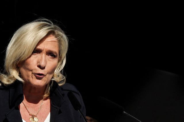 French far-right leader Marine Le Pen speaks at a rally in support of her, after calls for a peaceful mobilisation following Marine Le Pen's conviction for embezzlement of EU funds, resulting in her being barred from running for office for five years, in Paris, France, April 6, 2025. REUTERS/Gonzalo Fuentes/File Photo