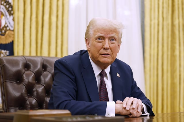 President Donald Trump speaks to reporters after signing a series of executive orders in the Oval Office of the White House on January 23, 2025 in Washington, DC.