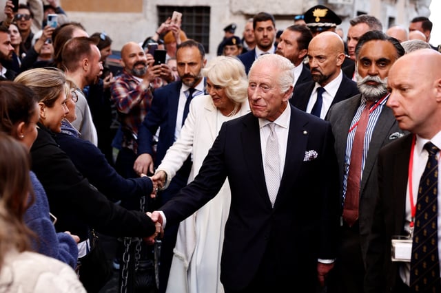 Britain's King Charles and Queen Camilla greet people during the state visit to Italy, in Rome, Italy, April 9, 2025. REUTERS/Vincenzo Livieri/Pool