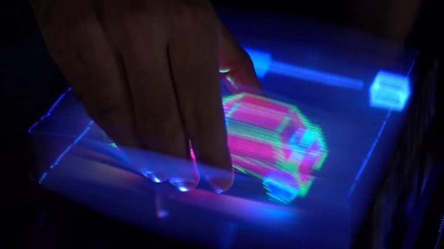 A 3D car is grabbed and rotated by a user.