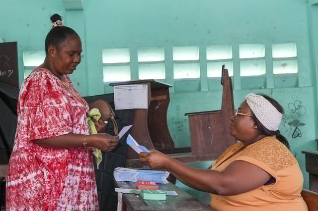 FILE - A woman votes in a referendum on whether to adopt a new constitution, in Libreville, Gabon, on Nov. 16, 2024. (AP Photo/Betines Makosso, File)