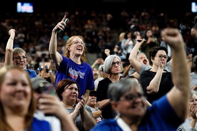 People cheer during a "Fighting Oligarchy" rally in Tempe, Arizona, on March 20.