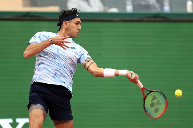 Tennis - ATP Masters 1000 - Monte Carlo Masters - Monte Carlo Country Club, Roquebrune-Cap-Martin, France - April 9, 2025 Chile's Alejandro Tabilo in action during his round of 32 match against Serbia's Novak Djokovic REUTERS/Manon Cruz