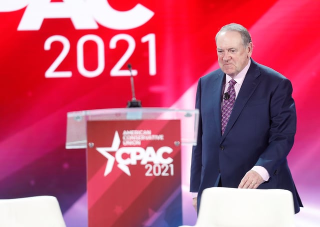 Former Arkansas Governor Mike Huckabee walks on stage  while attending the Reagan dinner at the Conservative Political Action Conference (CPAC) in Orlando, Florida, U.S. February 27, 2021. REUTERS/Octavio Jones