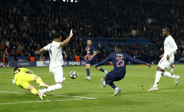 Soccer Football - Champions League - Quarter Final - First Leg - Paris St Germain v Aston Villa - Parc des Princes, Paris, France - April 9, 2025 Paris St Germain's Nuno Mendes scores their third goal Action Images via Reuters/Jason Cairnduff