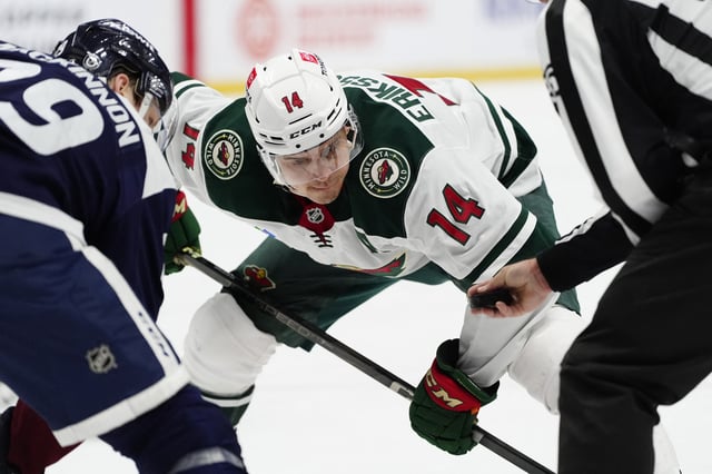 Jan 20, 2025; Denver, Colorado, USA; Minnesota Wild center Joel Eriksson Ek (14) prepares to take a face off  in the third period against the Colorado Avalanche at Ball Arena. Mandatory Credit: Ron Chenoy-Imagn Images/File Photo