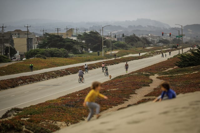 Cyclists ride their bikes on Great Highway on Tuesday, Aug. 10, 2021, in San Francisco. 