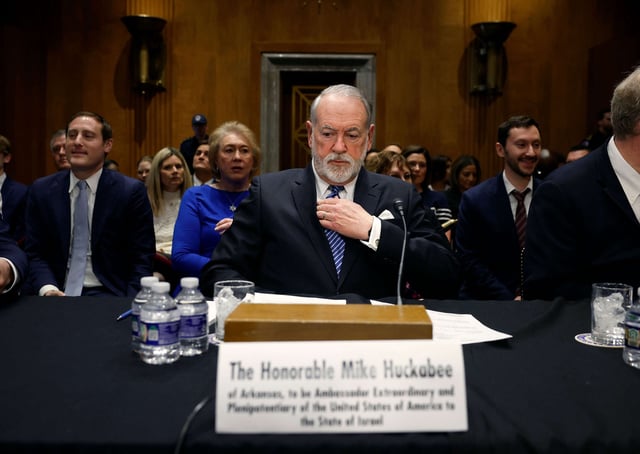 Former Arkansas Gov. Mike Huckabee, President Donald Trump's nominee to be ambassador to Israel, arrives to testify during his Senate Foreign Relations Committee confirmation hearing at the Dirksen Senate Office Building on March 25, 2025, in Washington, D.C.
