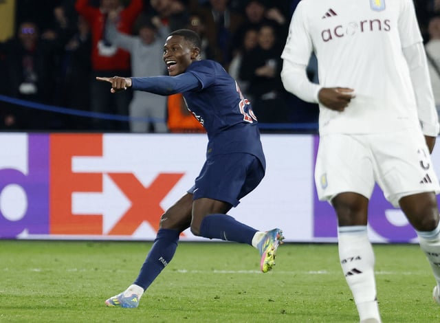 Soccer Football - Champions League - Quarter Final - First Leg - Paris St Germain v Aston Villa - Parc des Princes, Paris, France - April 9, 2025 Paris St Germain's Nuno Mendes celebrates scoring their third goal REUTERS/Stephanie Lecocq
