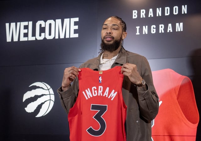 Toronto Raptors forward Brandon Ingram holds his new jersey in Toronto on Wednesday, Feb. 12, 2025. THE CANADIAN PRESS/Frank Gunn