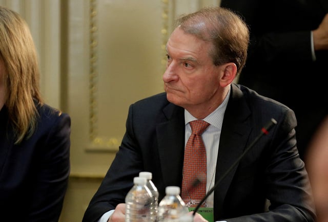 CEO of Patomak Global Partners Paul Atkins takes part in a strategic and policy CEO discussion with U.S. President Donald Trump in the Eisenhower Execution Office Building in Washington, U.S., April 11, 2017.  REUTERS/Joshua Roberts/File Photo