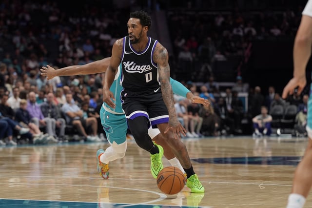 Apr 4, 2025; Charlotte, North Carolina, USA; Sacramento Kings guard Malik Monk (0) drives to the basket against the Charlotte Hornets during the second quarter at Spectrum Center. Mandatory Credit: Jim Dedmon-Imagn Images/File Photo