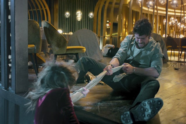 Brandon Sklenar, right, and Meghann Fahy in a scene from “Drop.” 