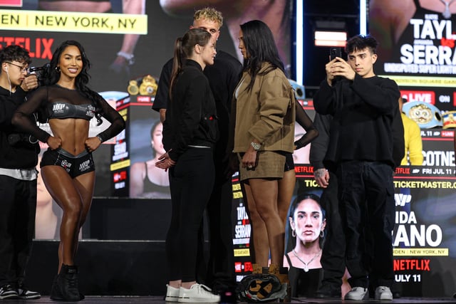 Apr 9, 2025; New York, New York, USA; Katie Taylor (left) and Amanda Serrano (right) face off in front of Jake Paul during a press conference ahead of their boxing match at Madison Square Garden. Mandatory Credit: Vincent Carchietta-Imagn Images