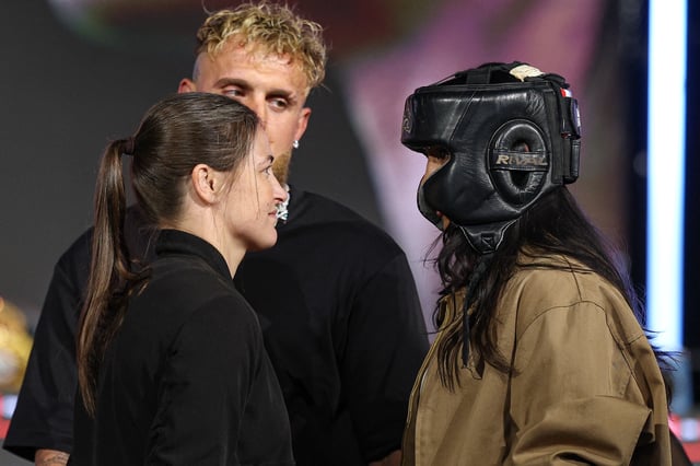 Apr 9, 2025; New York, New York, USA; Katie Taylor (left) and Amanda Serrano (right) face off in front of Jake Paul during a press conference ahead of their boxing match at Madison Square Garden. Mandatory Credit: Vincent Carchietta-Imagn Images