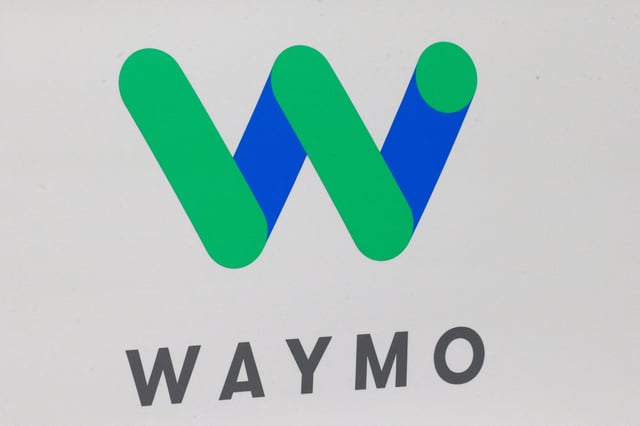 The Waymo logo is displayed during the North American International Auto Show in Detroit, Michigan, U.S., January 8, 2017.  REUTERS/Brendan McDermid/File Photo
