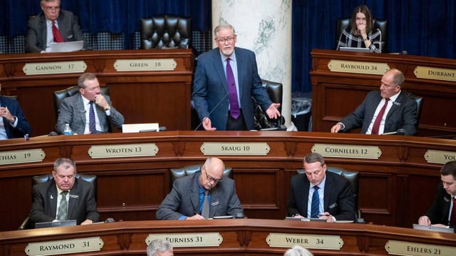 Idaho state Rep. Bruce Skaug, center, sponsored the bill that will make the firing squad his state's primary execution method instead of lethal injection.