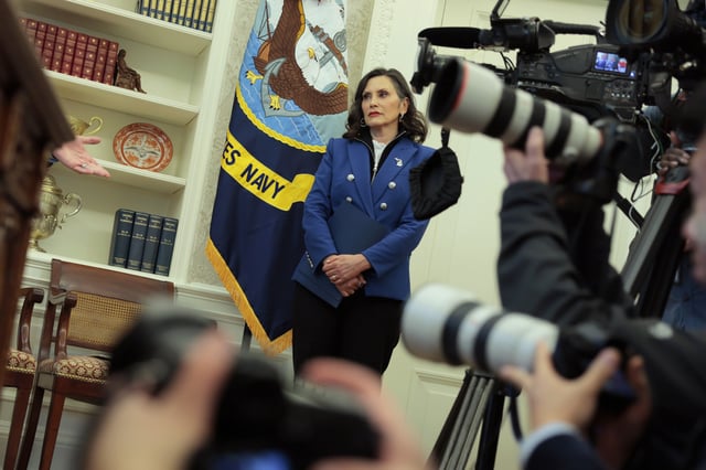 Michigan Governor Gretchen Whitmer looks on as President Donald Trump signs executive orders in the Oval Office of the White House on April 09, 2025 in Washington, DC.