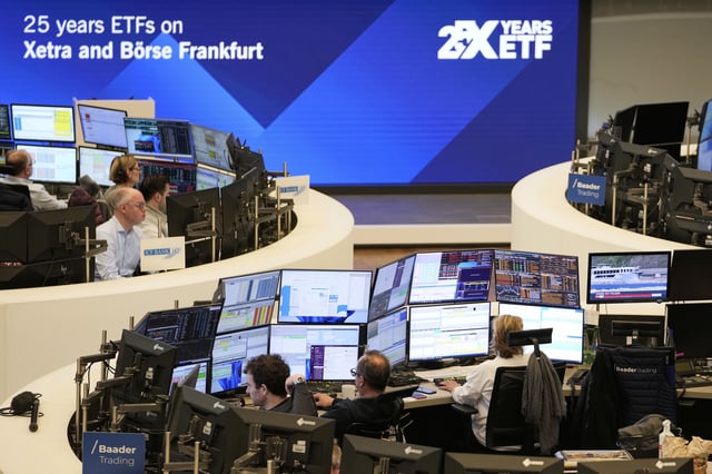Traders work on the trading floor of the Frankfurt Stock Exchange in Frankfurt, Germany, the day after U.S. President Donald Trumpannounced a 90-day pause on 'reciprocal' tariffs, Thursday, April 10, 2025. (AP Photo/Martin Meissner)