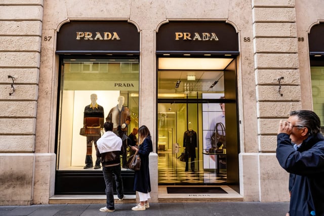 Prada buys Versace for $1.38 billion.