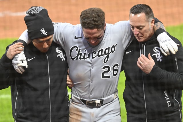 Apr 9, 2025; Cleveland, Ohio, USA; Chicago White Sox catcher Korey Lee (26) is helped to the dugout after he was injured while being picked off first base in the sixth inning against the Cleveland Guardians at Progressive Field. Mandatory Credit: David Richard-Imagn Images/ File Photo