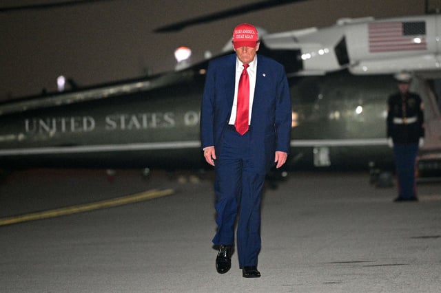 President Donald Trump steps off Marine One and walks to board Air Force One before departing Miami International Airport, in Miami, Florida, on April 3, 2025.