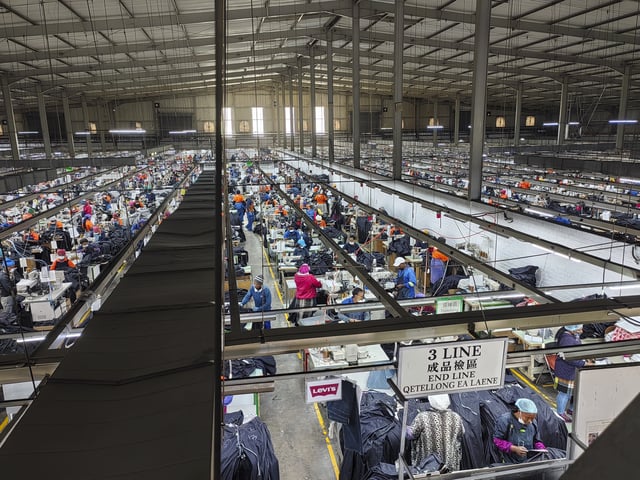 Workers assemble Levi's jeans in the Chinese owned Nien Hsing International factory in Maseru, Lesotho, Wednesday, April 9, 2025. (AP Photo/Keketso Phakela)