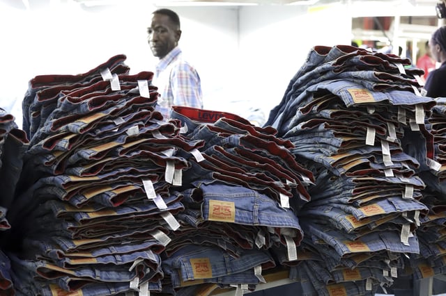 A label reading "Levis" on a pair of Levi Strauss & Co jeans are displayed at a production line at United Aryan EPZ Limited in Ruaraka on the outskirts of Nairobi, Kenya Friday, March. 21, 2025. (AP Photo/Andrew Kasuku)