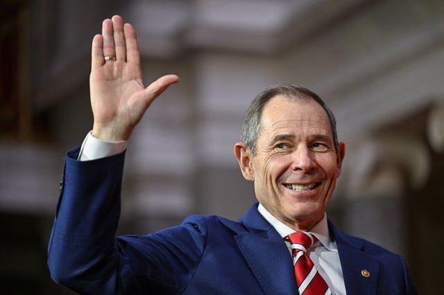 U.S. Senator John Curtis (R-UT) is ceremonially sworn into office by Vice President Kamala Harris during a re-enactment in the Old Senate Chamber on the first day of the 119th Congress at the U.S. Capitol in Washington, U.S., January 3, 2025. REUTERS/Jon Cherry  