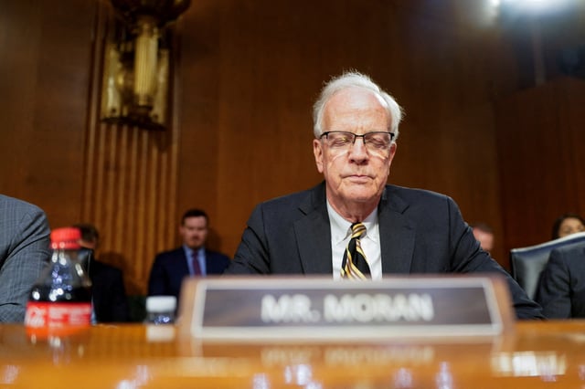 U.S. Senator Jerry Moran bows his head during a moment of silence honoring victims of American Airlines flight 5342 during a Senate Intelligence Committee confirmation hearing on Former Representative Tulsi Gabbard, U.S. President Donald Trump's nominee to be director of national intelligence, on Capitol Hill in Washington, U.S., January 30, 2025. REUTERS/Nathan Howard