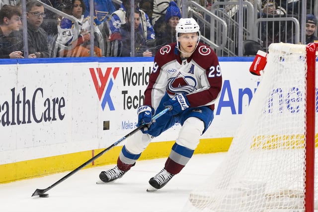Apr 5, 2025; St. Louis, Missouri, USA;  Colorado Avalanche center Nathan MacKinnon (29) controls the puck against the St. Louis Blues during the third period at Enterprise Center. Mandatory Credit: Jeff Curry-Imagn Images/File Photo