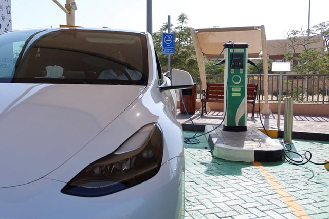 A TESLA electric car is seen at a charging station in Dubai, United Arab Emirates, April 8, 2025, REUTERS/Abdelhadi Ramahi REFILE - CORRECTING YEAR FROM "2024" TO "2025".
