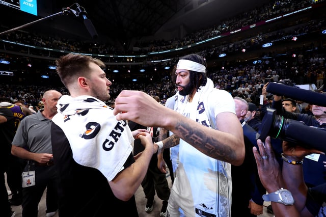 DALLAS, TEXAS - APRIL 09: Luka Doncic #77 of the Los Angeles Lakers shakes hands with Anthony Davis #3 of the Dallas Mavericks during the fourth quarter at American Airlines Center on April 09, 2025 in Dallas, Texas.