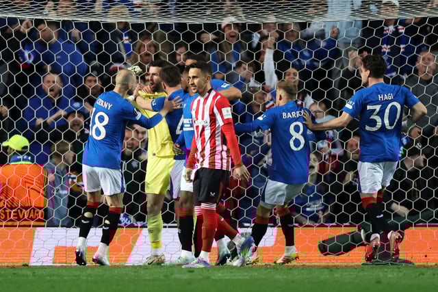 Soccer Football - Europa League - Quarter Final - First Leg - Rangers v Athletic Bilbao - Ibrox, Glasgow, Scotland, Britain - April 10, 2025 Athletic Bilbao's Alex Berenguer looks dejected as Rangers' Liam Kelly celebrates with teammates after saving his penalty kick REUTERS/Russell Cheyne