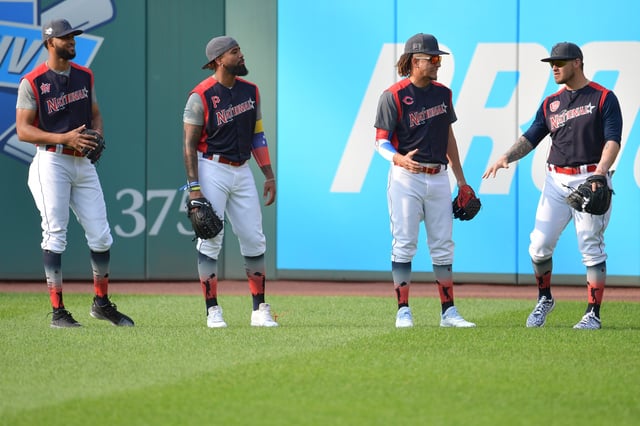 Sandy Alcantara of the Miami Marlins, Josh Bell of the Pittsburgh Pirates, Luis Castillo of the Cincinnati Reds and Yasmani Grandal of the Milwaukee Brewers talk during Gatorade All-Star Workout Day at Progressive Field on July 08, 2019 in Cleveland, Ohio.
