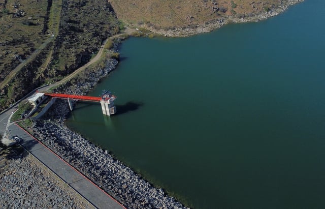 A drone view of El Carrizo dam, after the U.S. announced it will deny for the first time a request by Mexico to send water through a special delivery channel from the Colorado River to Tijuana, due to shortfalls in Mexico's water deliveries under the water sharing treaty signed in 1944 by both nations, in Tecate, Mexico, March 21, 2025. REUTERS/Jorge Duenes