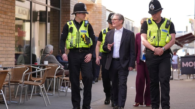 Sir Keir Starmer with police officers on patrol in Huntingdon, Cambridgeshire