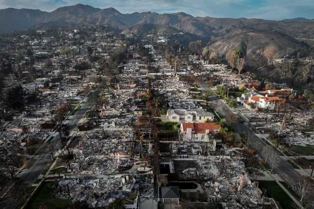 Destruction from the Palisades Fire in the Los Angeles area is seen on Feb. 3. State Farm has sought to raise rates significantly in the wake of the fires, but a final decision is not expected for weeks.