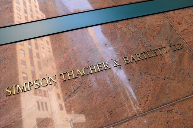 Signage is seen on the building exterior of the law firm Simpson Thacher & Bartlett LLP in Manhattan, New York City, U.S., August 17, 2020. REUTERS/Andrew Kelly