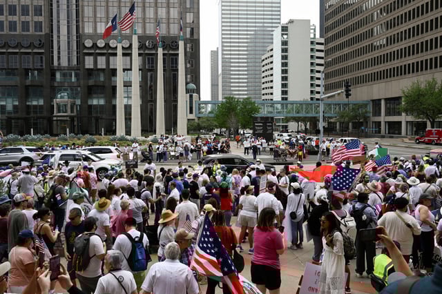 Demonstrators gather outside of the National Shrine Cathedral of Our Lady of Guadalupe before walking through the streets of downtown during the "Mega Marcha", calling for immigration reform, in Dallas, Texas, U.S. March 30, 2025. REUTERS/Jeremy Lock/File Photo