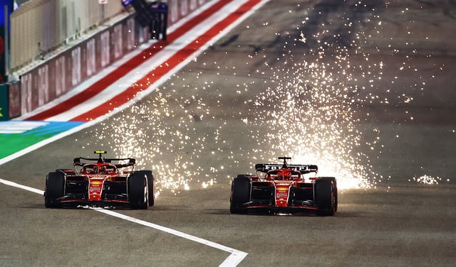 Sparks fly from the cars of Carlos Sainz of Spain driving (55) the Ferrari SF-24 and Charles Leclerc of Monaco driving the (16) Ferrari SF-24 as they compete for track position during the F1 Grand Prix of Bahrain on March 02, 2024 in Bahrain, Bahrain.