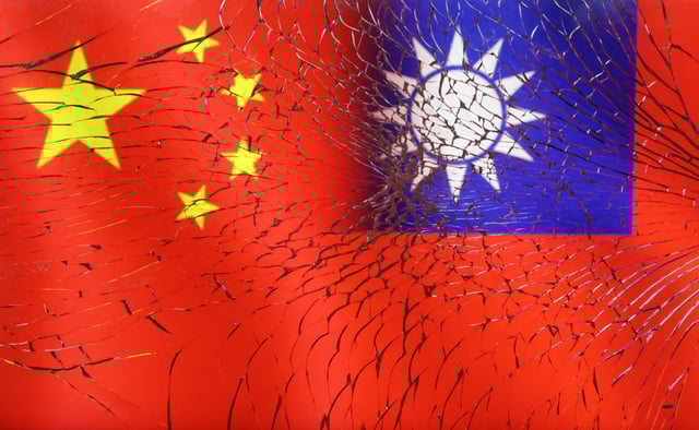 Chinese and Taiwanese flags are seen through broken glass in this illustration taken, April 11, 2023. REUTERS/Dado Ruvic/Illustration/File Photo