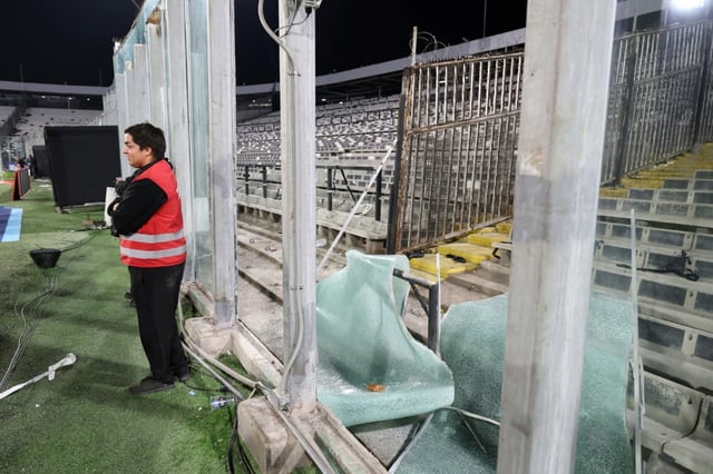 Two people died after fans and police clashed outside a stadium in Santiago ahead of a game in South America's Copa Libertadores football tournament on Thursday