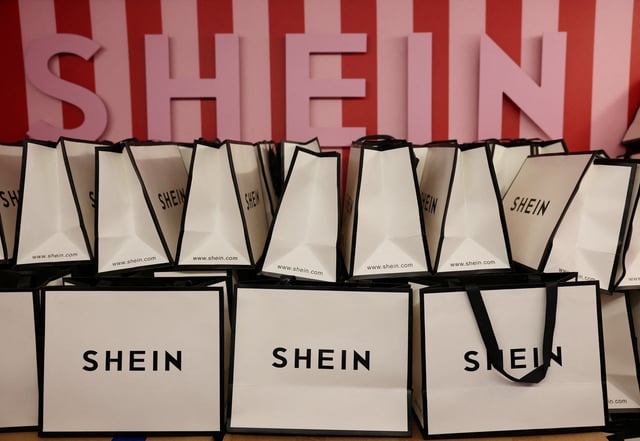 A company logo for fashion brand Shein is seen on a pile of gift bags on its Christmas bus as part of a nationwide promotional tour in Liverpool, Britain, December 14, 2024. REUTERS/Phil Noble/File Photo