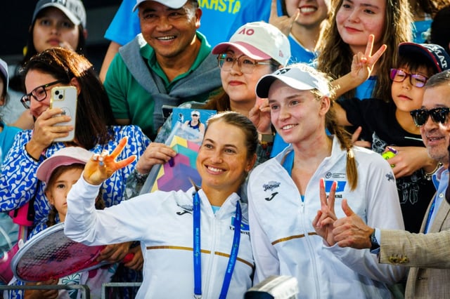 Kazakhstan's Elena Rybakina (R) and Yulia Putintseva (L) pose with fans during their  Billie Jean King Cup tie in Brisbane