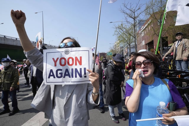 A supporter of recently ousted South Korean President Yoon Suk Yeol weeps during a rally to oppose his impeachment near the the presidential residence in Seoul, South Korea, Friday, April 11, 2025. (AP Photo/Ahn Young-joon)